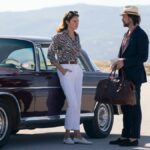 Shailene Woodley (L) leans against a car opposite Joseph Gordon-Levitt in Prime Video original movie, Killer Heat