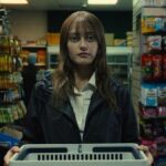 Ella Purnell, pictured in a convenience store wearing drab clothing, stars as Rhiannon Lewis in dark comedy TV show &quot;Sweetpea&quot; season 1