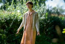 Claire (Rebecca Hall) stands peacfully in a sunlit grove in &quot;The Listeners&quot;