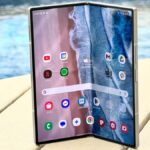 Samsung Galaxy Z Fold 6 on a table next to a pool