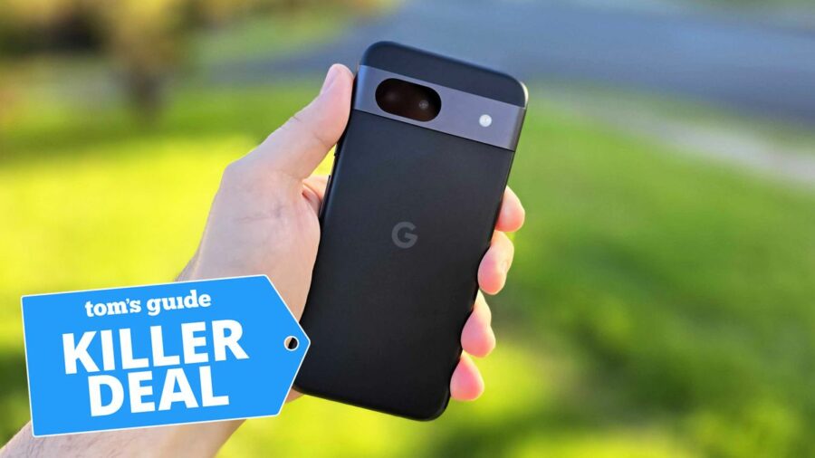 In-hand photo of the black Google Pixel 8a handset in front of outdoor setting with 'Killer Deal' badge overlaid.