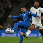 Tasos Bakasetas vies with England's midfielder Jude Bellingham during the UEFA Nations League football match between England and Greece ahead of Greece vs England