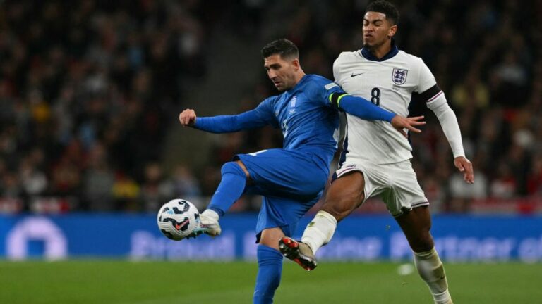 Tasos Bakasetas vies with England's midfielder Jude Bellingham during the UEFA Nations League football match between England and Greece ahead of Greece vs England