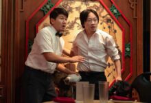 Ronny Cheng and Jimmy O. Yang (L-R) standing in a restaurant in Hulu's &quot;Interior Chinatown&quot;