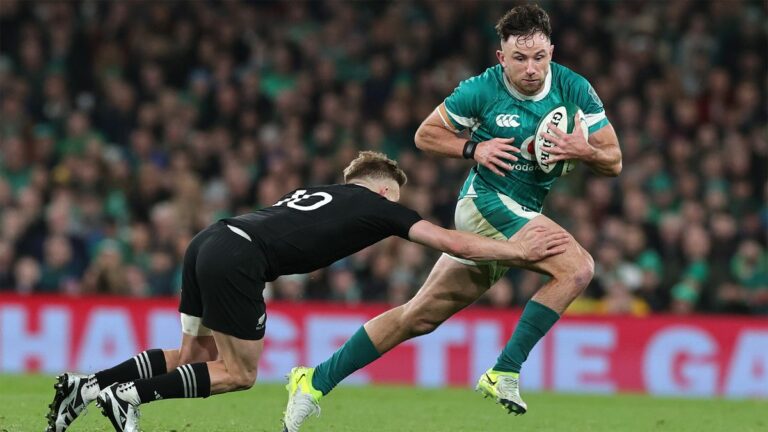 Ireland’s Hugo Keenan is tackled by New Zealand's Damian McKenzie in the sides' November 2024 encounter.