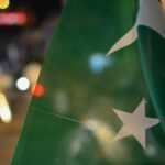 Pakistan flag in front of streetlights