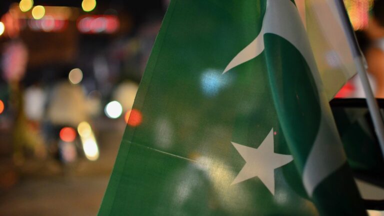 Pakistan flag in front of streetlights