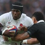 England's Maro Itoje is tackled by New Zealand's Ardie Savea during the teams' November 2024 match.