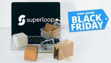 Superloop logo on laptop screen background with tiny shopping cart and brown gift bags on keyboard of laptop and Tom's Guide Black Friday blue badge on top right corner