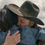 Monica (Kelsey Asbille) and Kayce Dutton (Luke Grimes) embrace each other tightly in Yellowstone season 5 episode 10