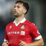 Thomas O'Connor of Wrexham AFC runs the pitch prior to the Harrogate Town vs Wrexham live stream in the FA Cup 2024