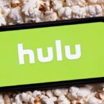 Hulu logo on iPhone on top of popcorn