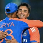 India's Abhishek Sharma celebrates with his captain Suryakumar Yadav (L) after taking a wicket in the build up to the South Africa vs India 1st T20 2024 live stream from Kingsmead