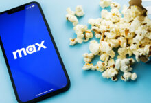 Max on a phone with popcorn
