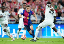 Gavi of Barcelona runs with the ball, evading the attention of three Real Madrid players during the January 2025 Spanish Super Cup final